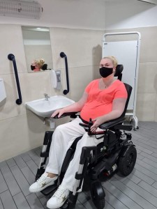 Kerry in her wheelchair in a changing places toilet￼